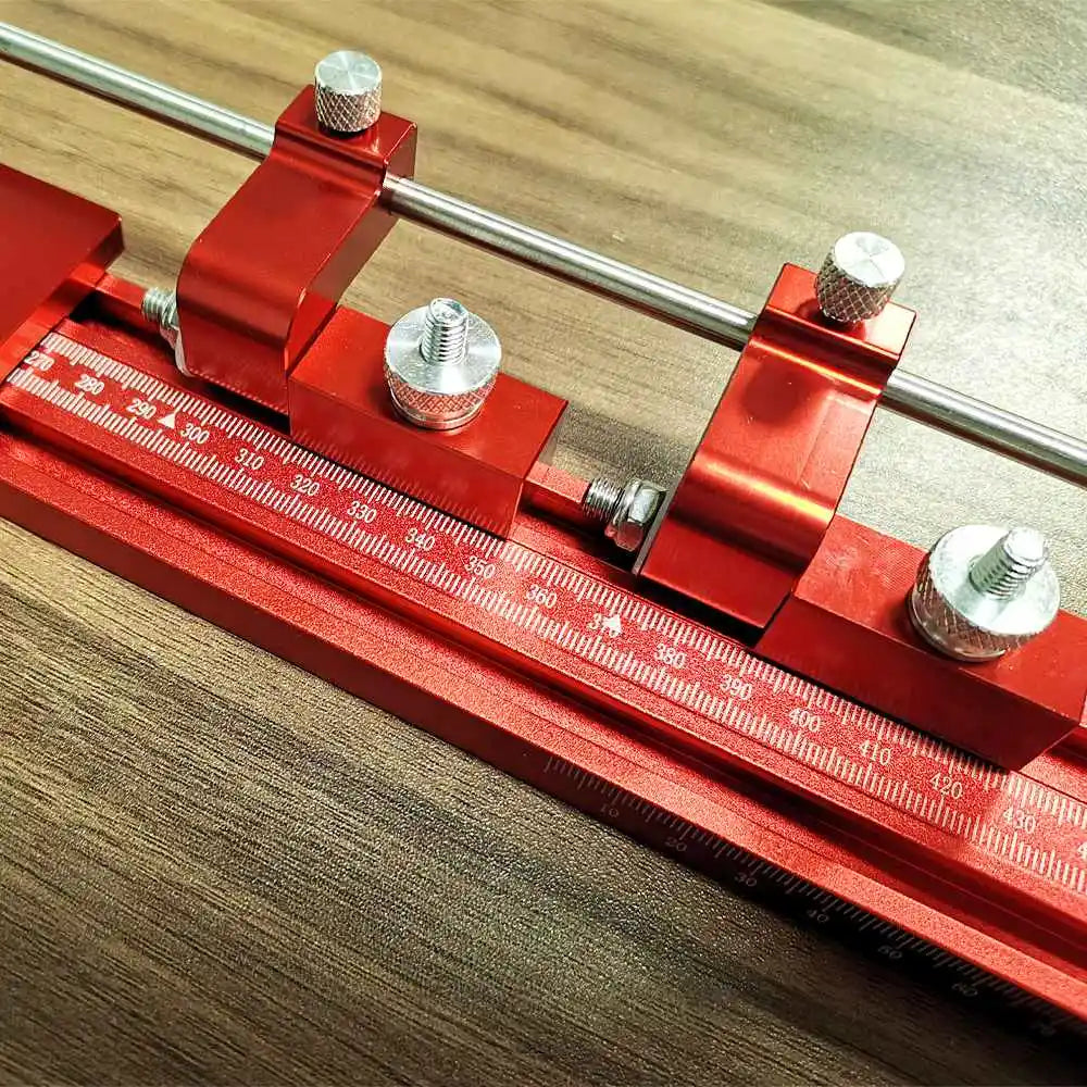 Festool TrackSaw Parallel Guide System with clamps, showcasing red clamps and measuring scale for precise woodworking cuts.