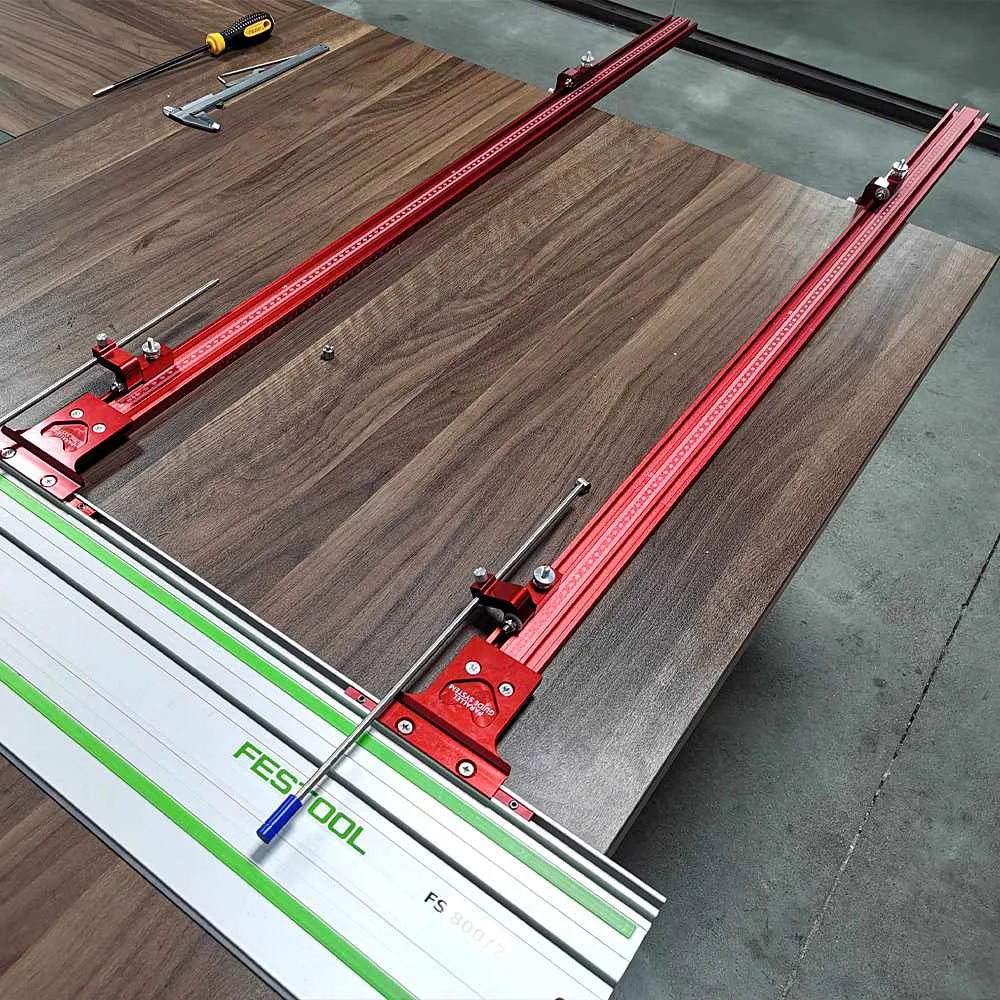 Festool TrackSaw Parallel Guide System with clamps on a wooden surface for precision cutting.