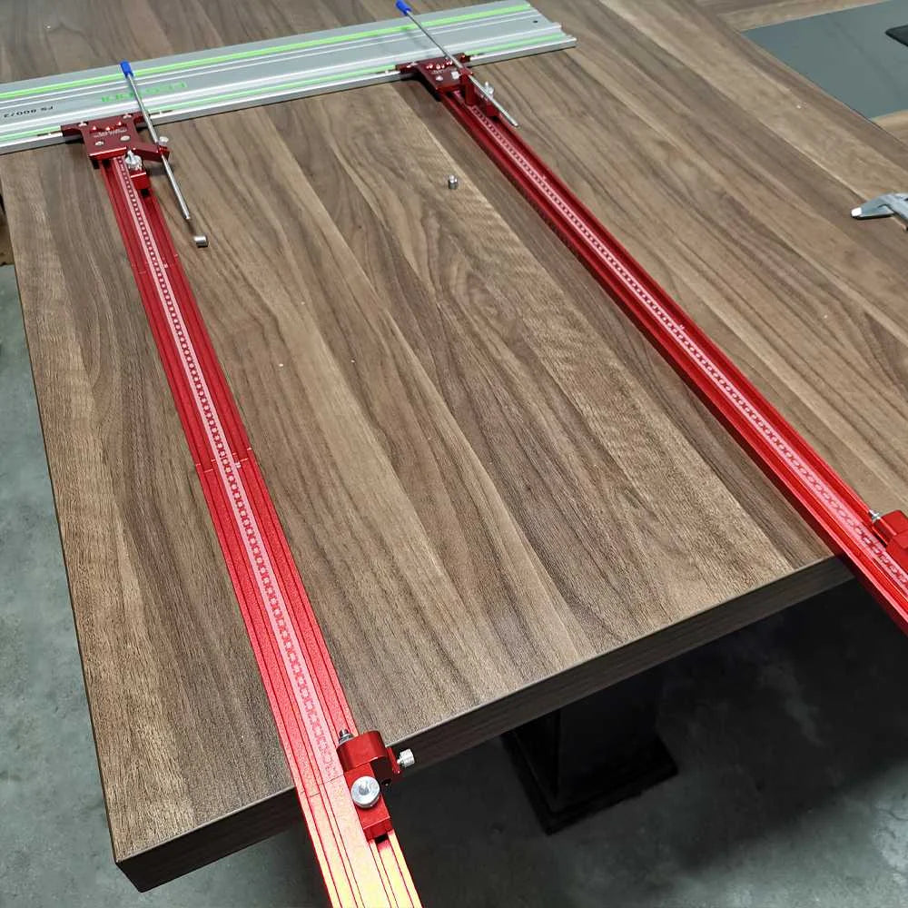 Festool TrackSaw Parallel Guide System with clamps set up on a wooden surface for precise woodworking cuts.